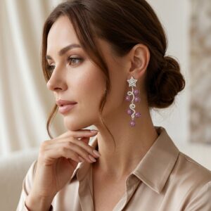 Luxury white gold chandelier earrings featuring six deep crimson ruby pavé disc drops and princess-cut centre stones